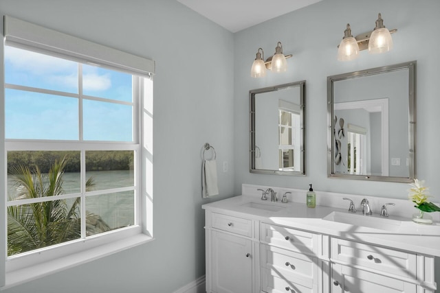 bathroom featuring double vanity and a sink