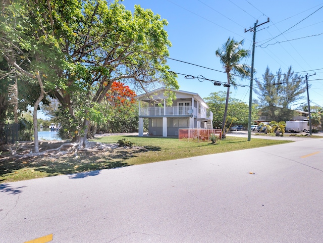 3806 Dyer Rd, Big Pine, FL 33043 - view of front of home with a front lawn and a balcony