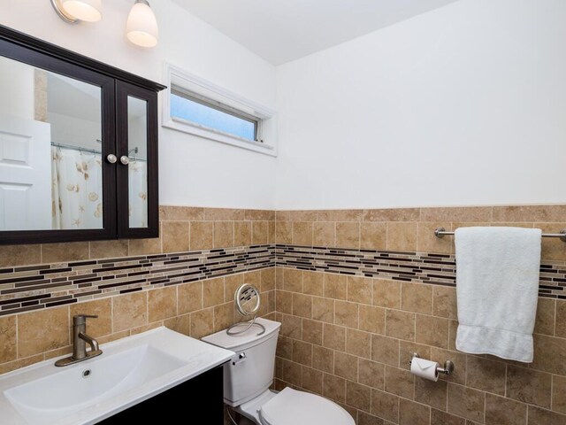 3806 Dyer Rd, Big Pine, FL 33043 - full bathroom with tile walls, vanity, and toilet