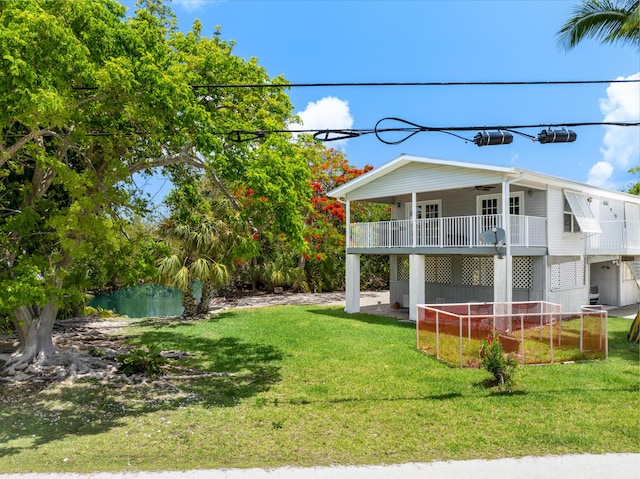 3806 Dyer Rd, Big Pine, FL 33043 - view of grassy yard featuring ceiling fan