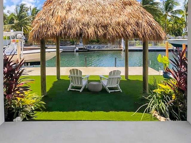 exterior space with a lawn and a water view