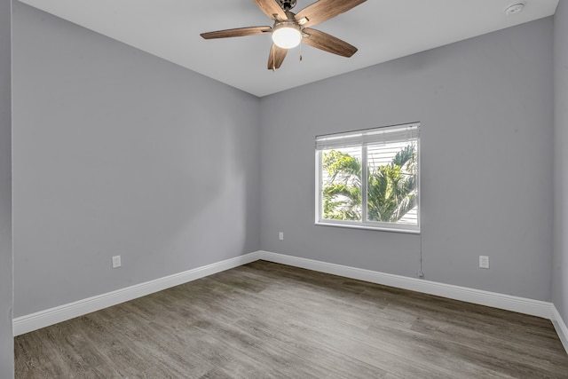 unfurnished room featuring hardwood / wood-style flooring and ceiling fan