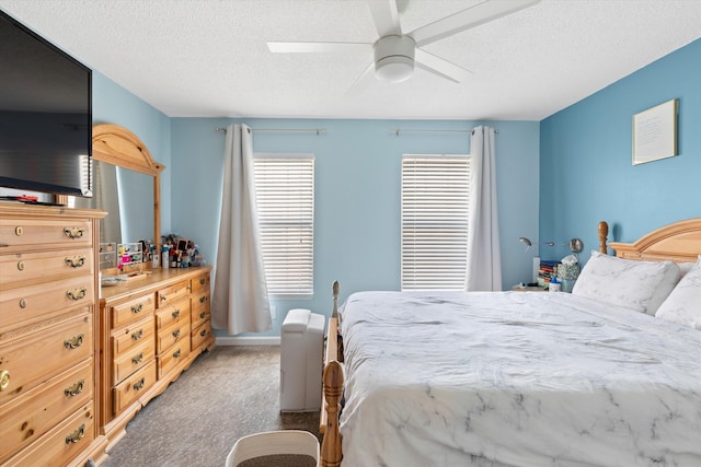 3397 Northside Dr Unit 4, Key West, FL 33040 - bedroom featuring multiple windows, light carpet, a textured ceiling, and a ceiling fan