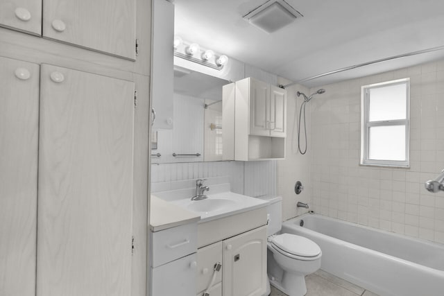 bathroom featuring vanity, tile patterned floors, toilet, and tub / shower combination