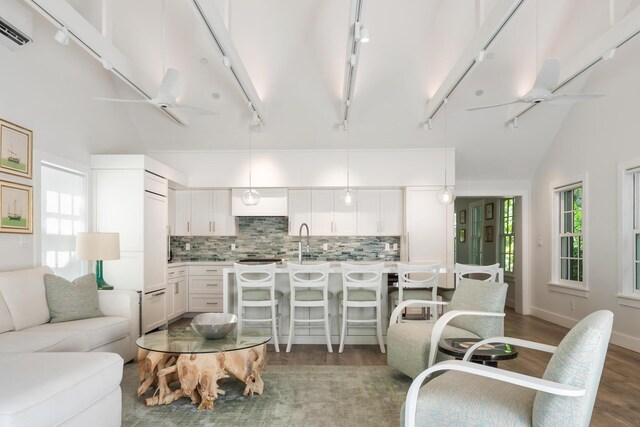 806 Southard St, Key West, FL 33040 - living room with visible vents, wood finished floors, lofted ceiling, ceiling fan, and rail lighting