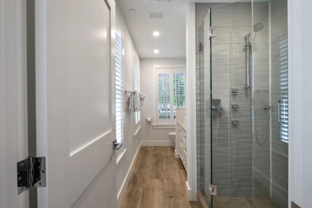 806 Southard St, Key West, FL 33040 - bathroom featuring vanity, recessed lighting, baseboards, wood finished floors, and a stall shower