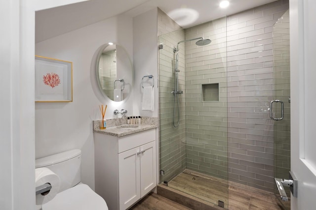 806 Southard St, Key West, FL 33040 - full bath with wood finished floors, a stall shower, toilet, and vanity