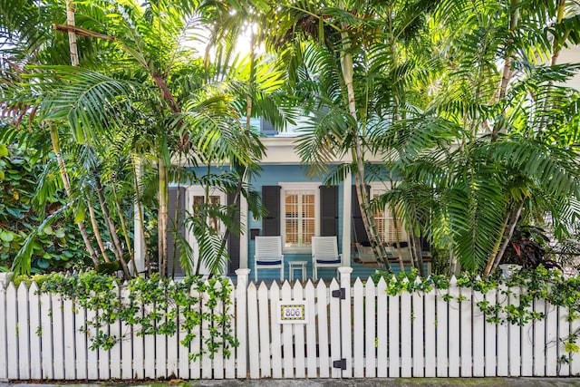 806 Southard St, Key West, FL 33040 - view of gate featuring covered porch and a fenced front yard