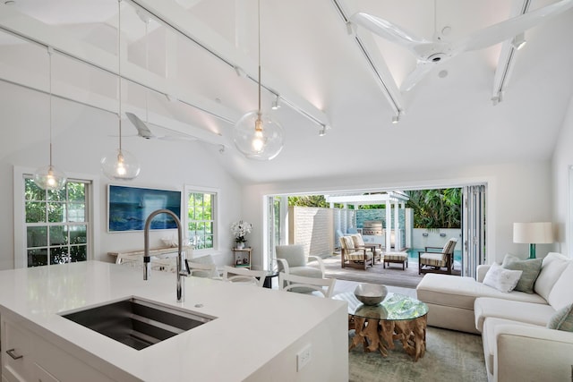 806 Southard St, Key West, FL 33040 - kitchen with track lighting, a sink, decorative light fixtures, open floor plan, and vaulted ceiling with beams