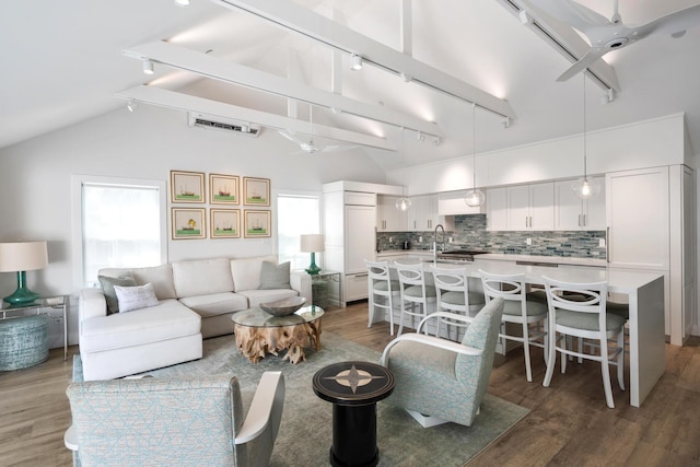 806 Southard St, Key West, FL 33040 - living room featuring a ceiling fan, rail lighting, lofted ceiling, and wood finished floors