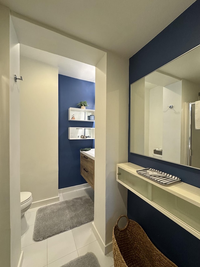 1728 Laird St, Key West, FL 33040 - bathroom featuring vanity, toilet, tile patterned floors, a shower with door, and baseboards