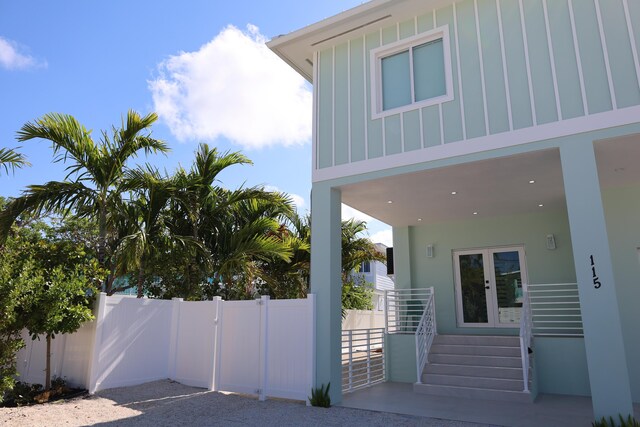 view of side of property featuring french doors