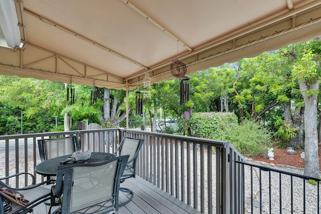 1 Sunset Rd, Key Largo, FL 33037 - deck featuring outdoor dining area and view of scattered trees