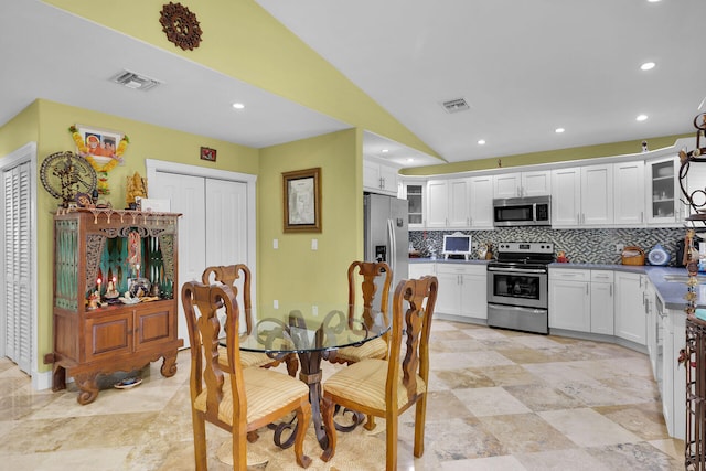 1 Sunset Rd, Key Largo, FL 33037 - dining room featuring recessed lighting and lofted ceiling
