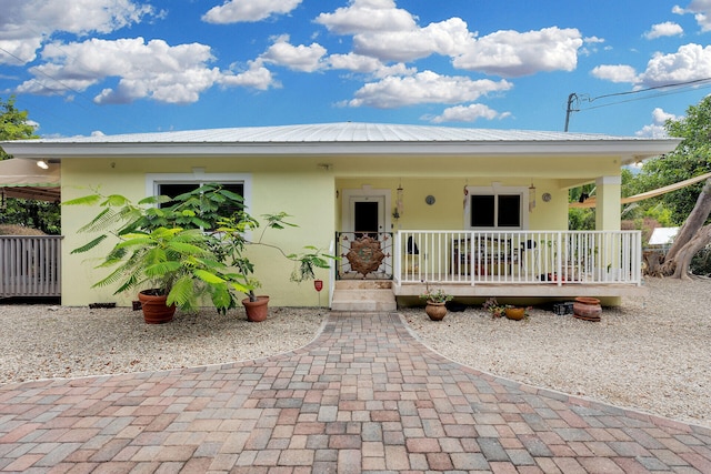1 Sunset Rd, Key Largo, FL 33037 - view of front of property featuring stucco siding and covered porch