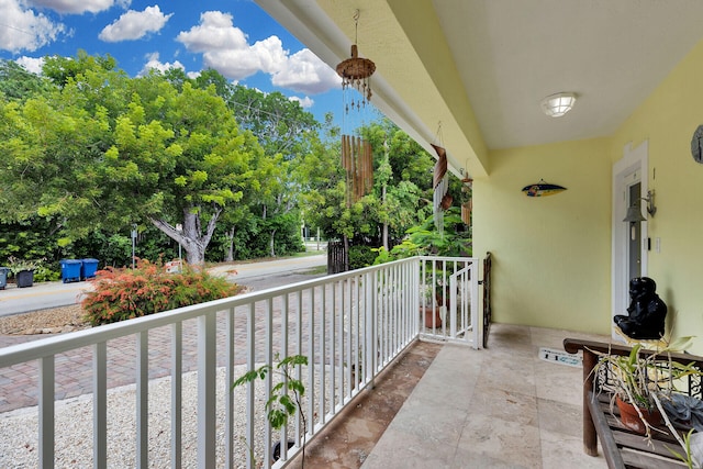 1 Sunset Rd, Key Largo, FL 33037 - porch featuring view of scattered trees