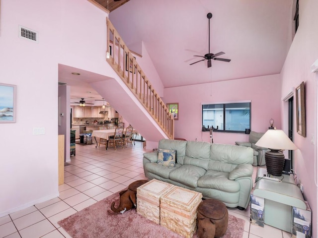 living room featuring high vaulted ceiling, light tile patterned floors, and ceiling fan