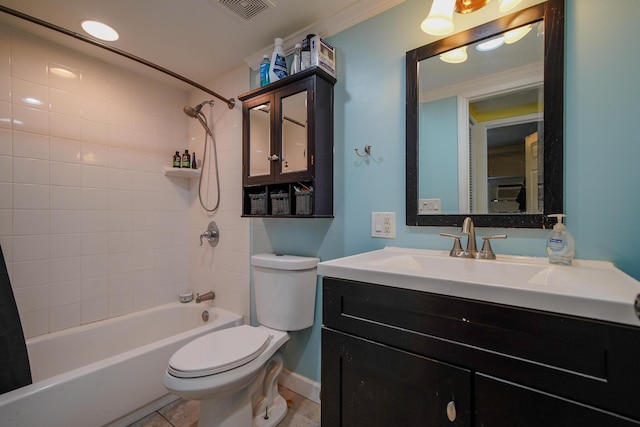 full bathroom with vanity, tiled shower / bath, tile patterned floors, and toilet