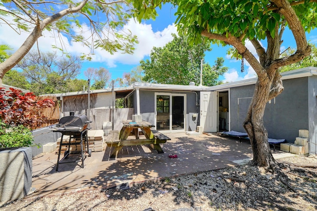 rear view of house featuring a patio area