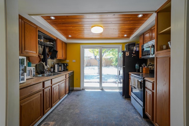 kitchen with wood ceiling, stainless steel appliances, a tray ceiling, and sink