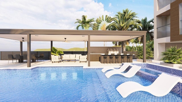 view of swimming pool featuring ceiling fan, an outdoor bar, and a patio