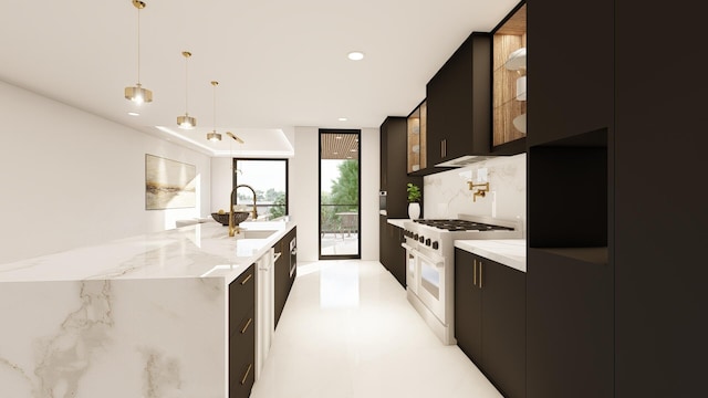 kitchen featuring decorative light fixtures, range with gas stovetop, sink, and light stone countertops