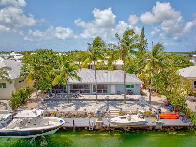 20735 W 5th Ave, Cudjoe, FL 33042 - back of property with a water view and a patio area