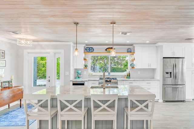 20735 W 5th Ave, Cudjoe, FL 33042 - kitchen with appliances with stainless steel finishes, open shelves, healthy amount of natural light, a center island with sink, and wood ceiling