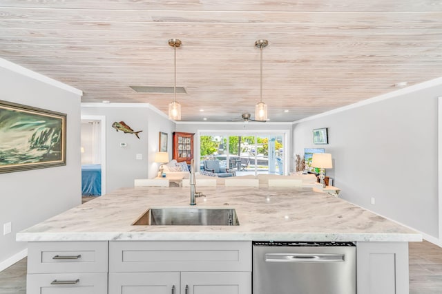 20735 W 5th Ave, Cudjoe, FL 33042 - kitchen with stainless steel dishwasher, ornamental molding, open floor plan, light stone countertops, and hanging light fixtures