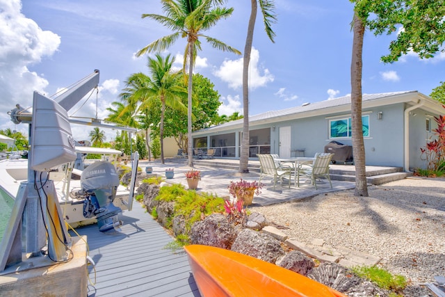 20735 W 5th Ave, Cudjoe, FL 33042 - back of property featuring stucco siding and a patio