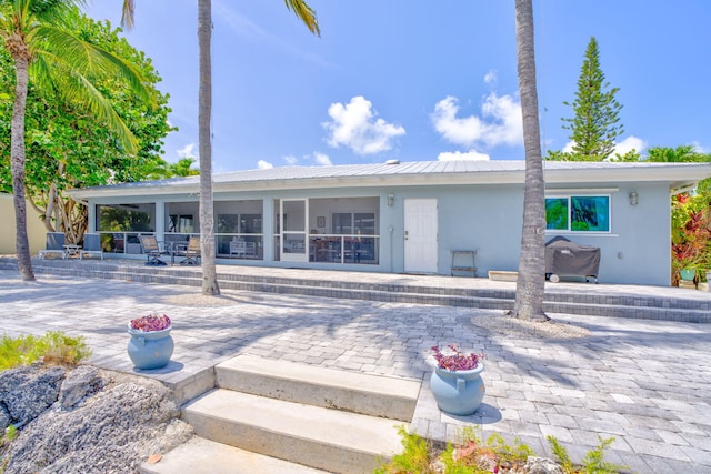 20735 W 5th Ave, Cudjoe, FL 33042 - rear view of property with a patio and stucco siding