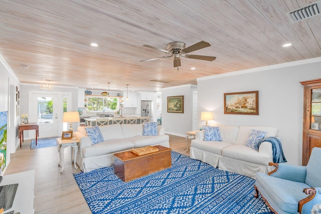 20735 W 5th Ave, Cudjoe, FL 33042 - living area featuring wooden ceiling, ceiling fan, crown molding, recessed lighting, and light wood finished floors