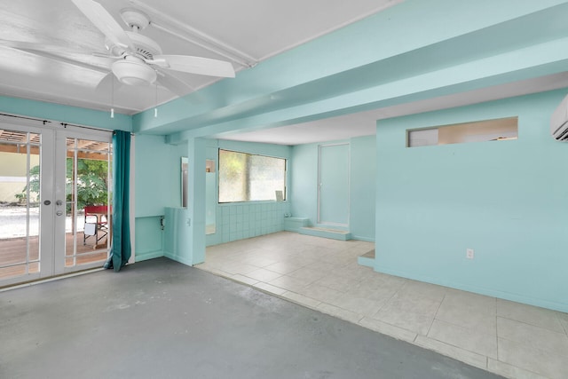 empty room with ceiling fan and french doors