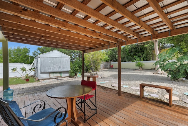 wooden terrace with a shed