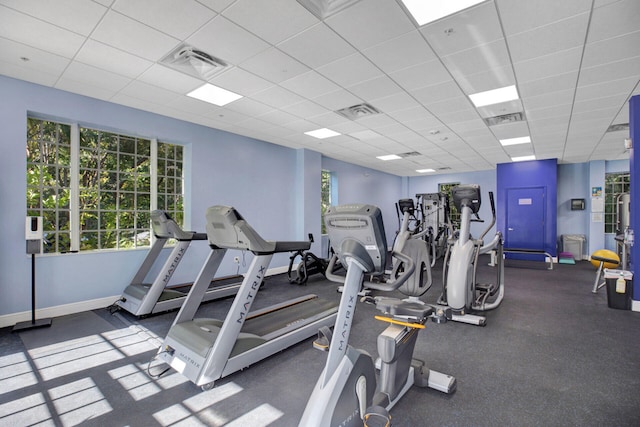 workout area featuring a paneled ceiling