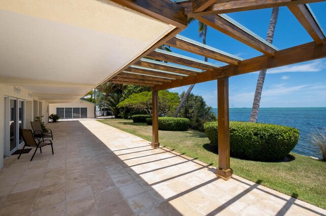 view of patio featuring a water view