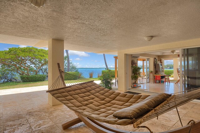 view of patio / terrace with a water view