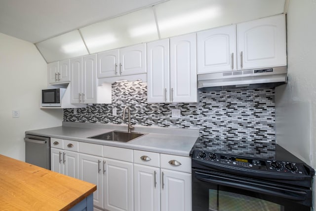 kitchen with backsplash, under cabinet range hood, white cabinets, black electric range oven, and a sink