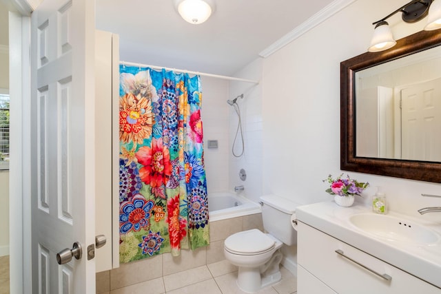 bathroom featuring vanity, ornamental molding, tile patterned flooring, tiled shower / bath combo, and toilet