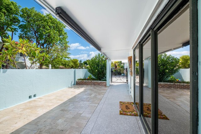 view of patio featuring a gate and fence