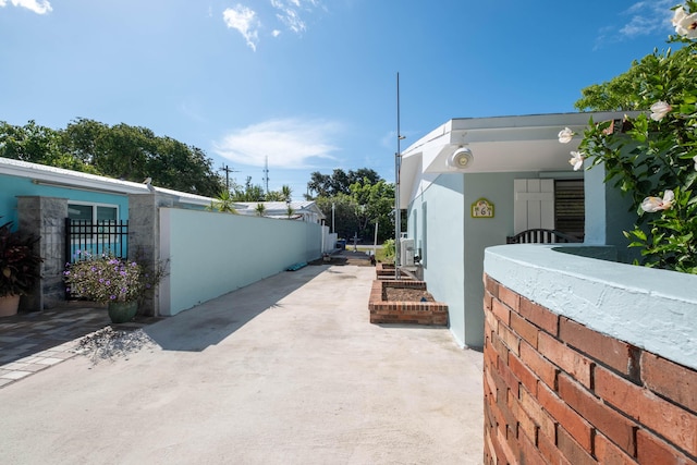 view of home's exterior featuring a patio, fence, and stucco siding