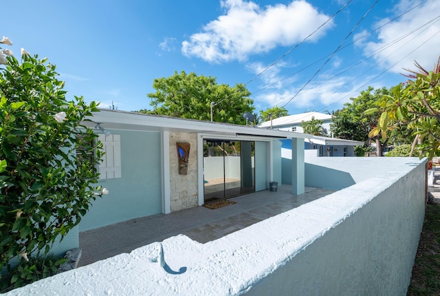 exterior space with stucco siding