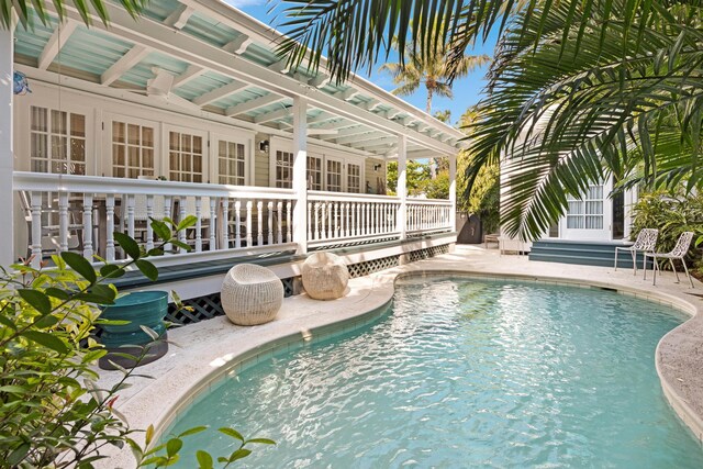 view of swimming pool featuring a deck