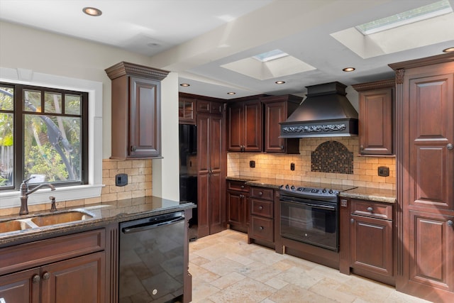 3532 Duck Ave, Key West, FL 33040 - kitchen with a sink, a skylight, dark stone counters, black appliances, and custom range hood