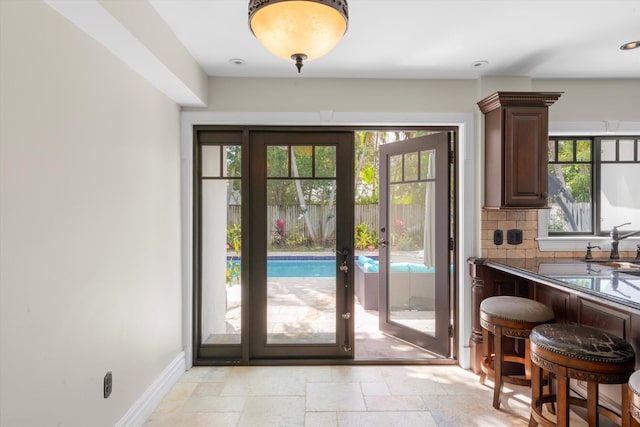 3532 Duck Ave, Key West, FL 33040 - entryway with baseboards, french doors, and stone tile floors