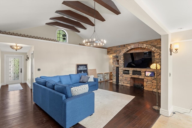 3532 Duck Ave, Key West, FL 33040 - living room featuring baseboards, a stone fireplace, a chandelier, high vaulted ceiling, and wood finished floors