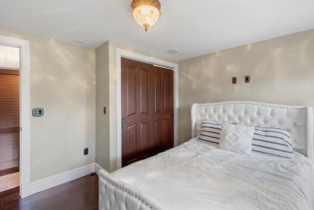 3532 Duck Ave, Key West, FL 33040 - bedroom with baseboards, dark wood-style flooring, and a closet