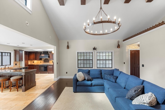 3532 Duck Ave, Key West, FL 33040 - living area featuring an inviting chandelier, light wood-style flooring, baseboards, and high vaulted ceiling