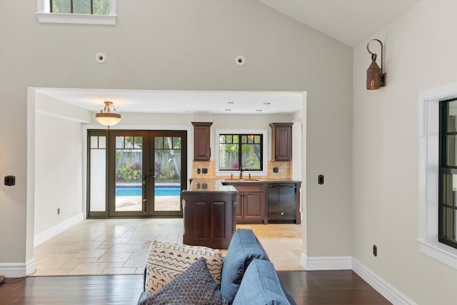 3532 Duck Ave, Key West, FL 33040 - interior space with baseboards, french doors, and high vaulted ceiling