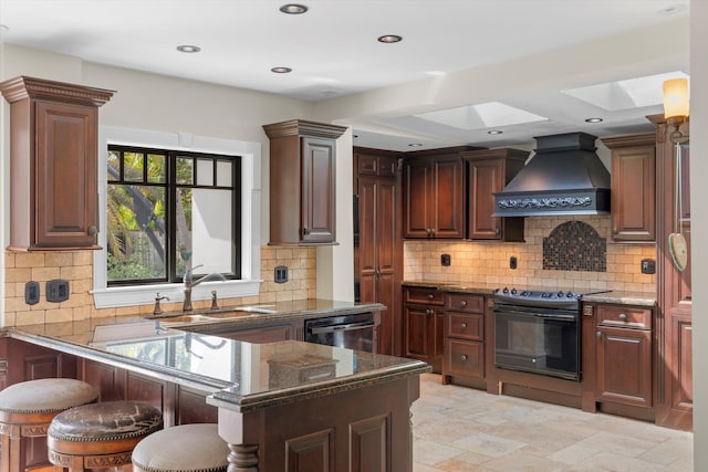 3532 Duck Ave, Key West, FL 33040 - kitchen with dishwasher, a sink, premium range hood, black range with electric cooktop, and a skylight